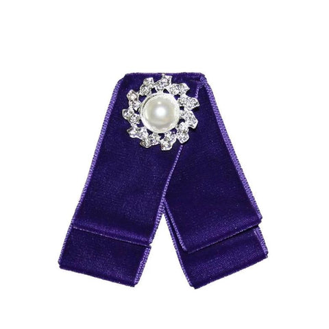 Front View of a Purple Suede Bow Brooch